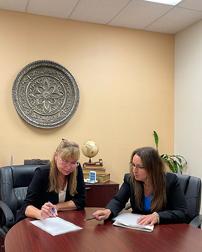 Cynthia I. Waisman with a client
